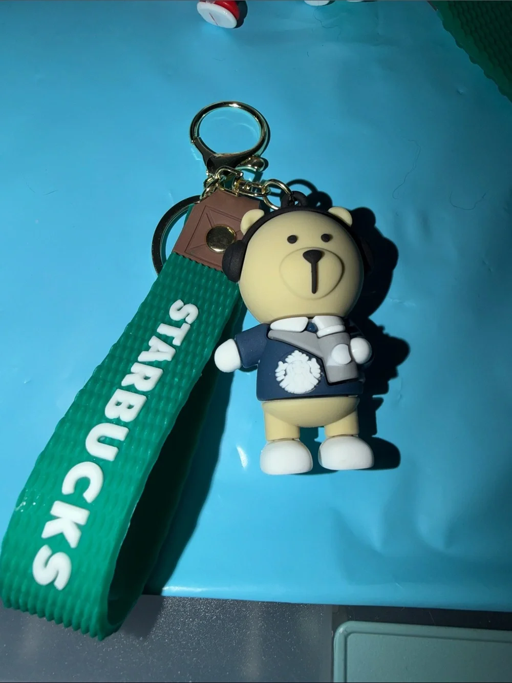 Beige Bear Keychain with Green Strap and Navy Outfit
